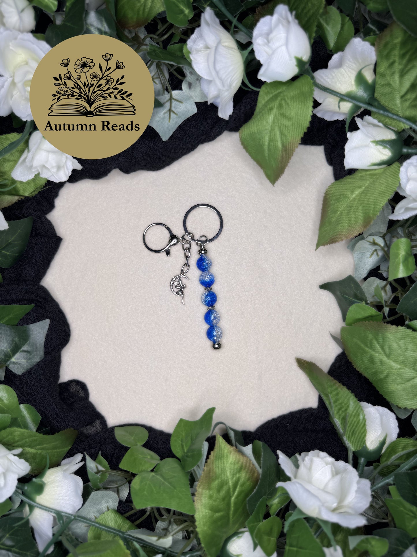 Fairy Moon handmade beaded bar keychain with blue glass beads, fairy charm, and crescent moon charm by Autumn Reads LLC