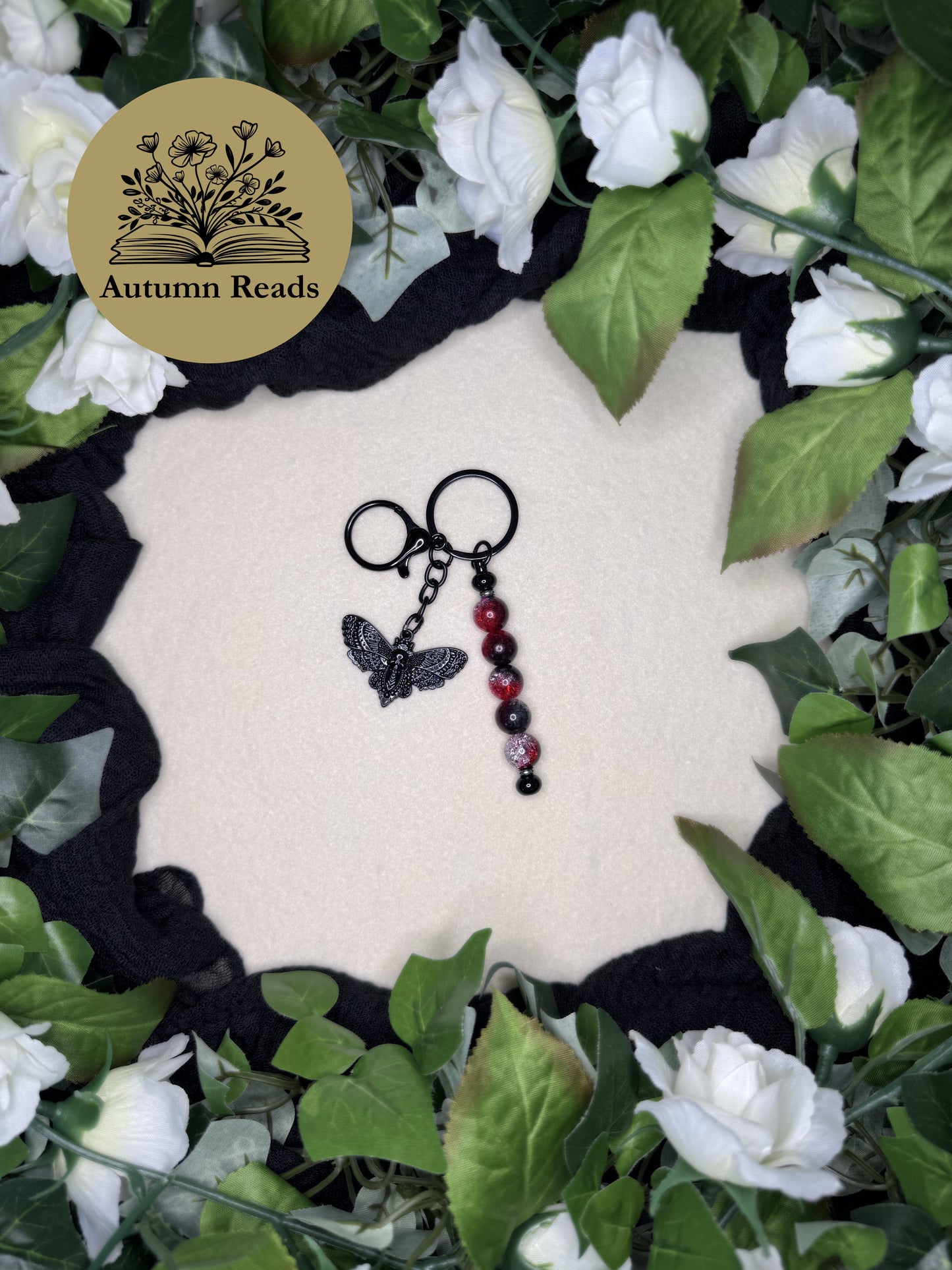 Midnight Moth handmade beaded bar keychain with red glass beads and black skull moth charm by Autumn Reads LLC