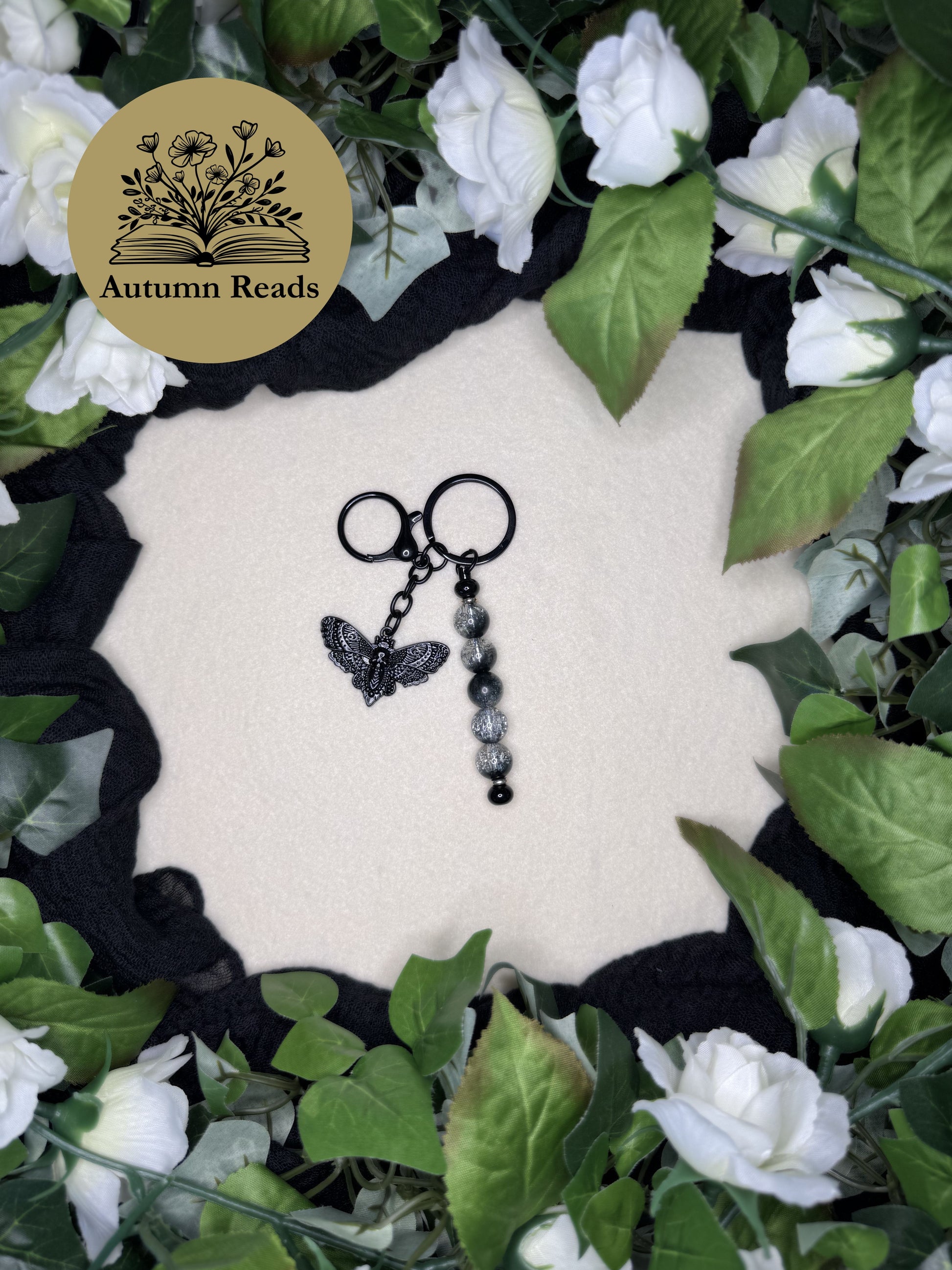Midnight Moth handmade beaded bar keychain with black glass beads and black skull moth charm by Autumn Reads LLC