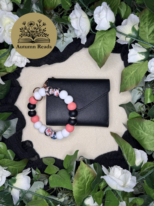 Everyday Daisy handmade beaded keychain paired with a black faux leather wallet by Autumn Reads LLC