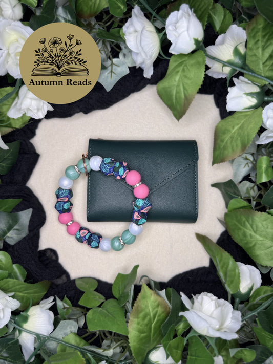 Fresh Papaya handmade beaded keychain paired with a green faux leather wallet by Autumn Reads LLC